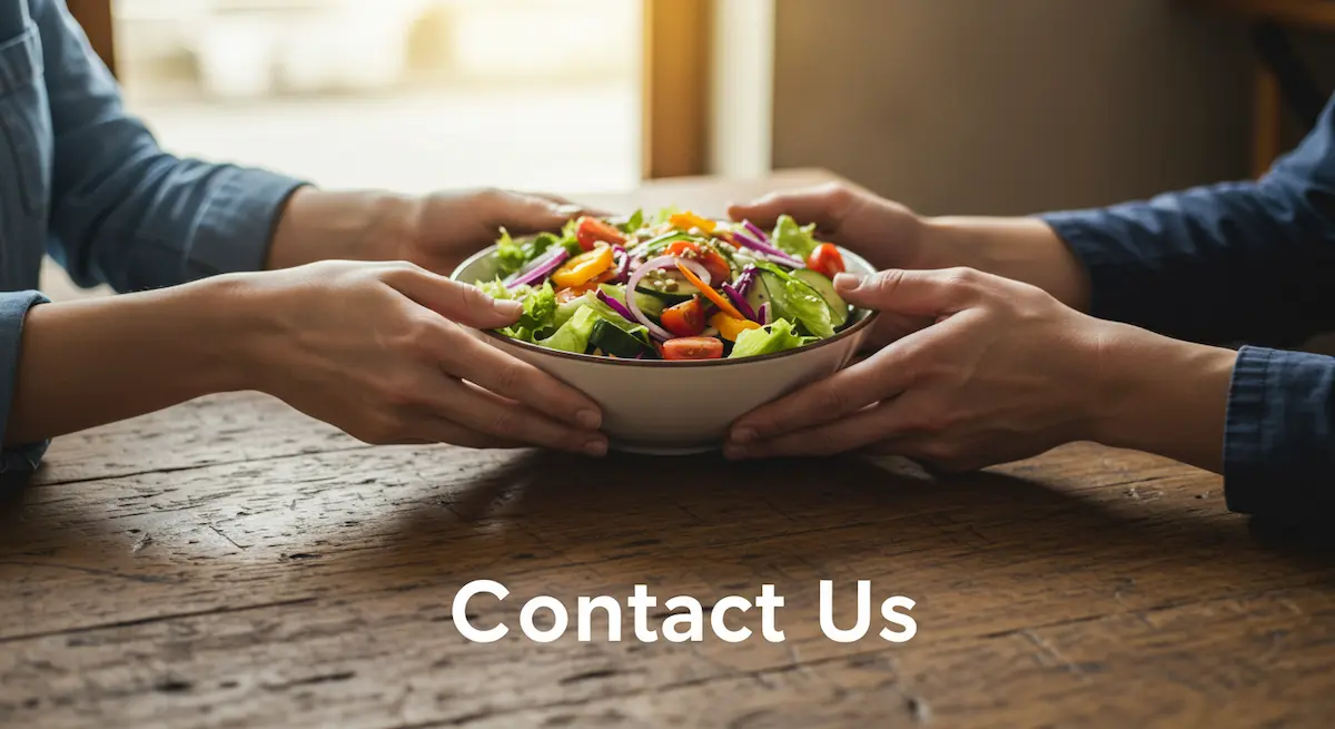 Contact Us: Two hands exchanging a healthy salad bowl