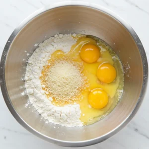 Stainless steel mixing bowl used for coating chicken nuggets