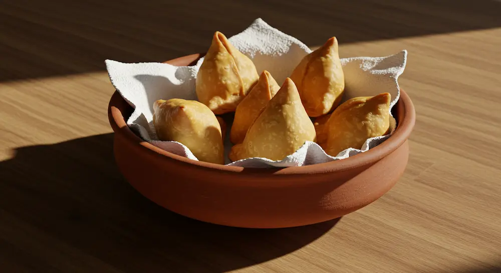 Samosas dough resting in a terracotta bowl