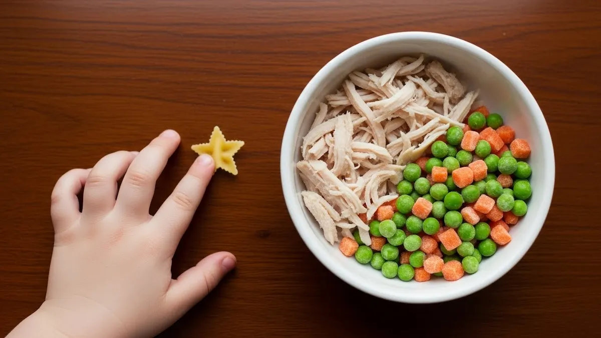 Overhead flat lay of all ingredients for immune-boosting chicken soup: broth, ginger, chicken, pasta, and more.